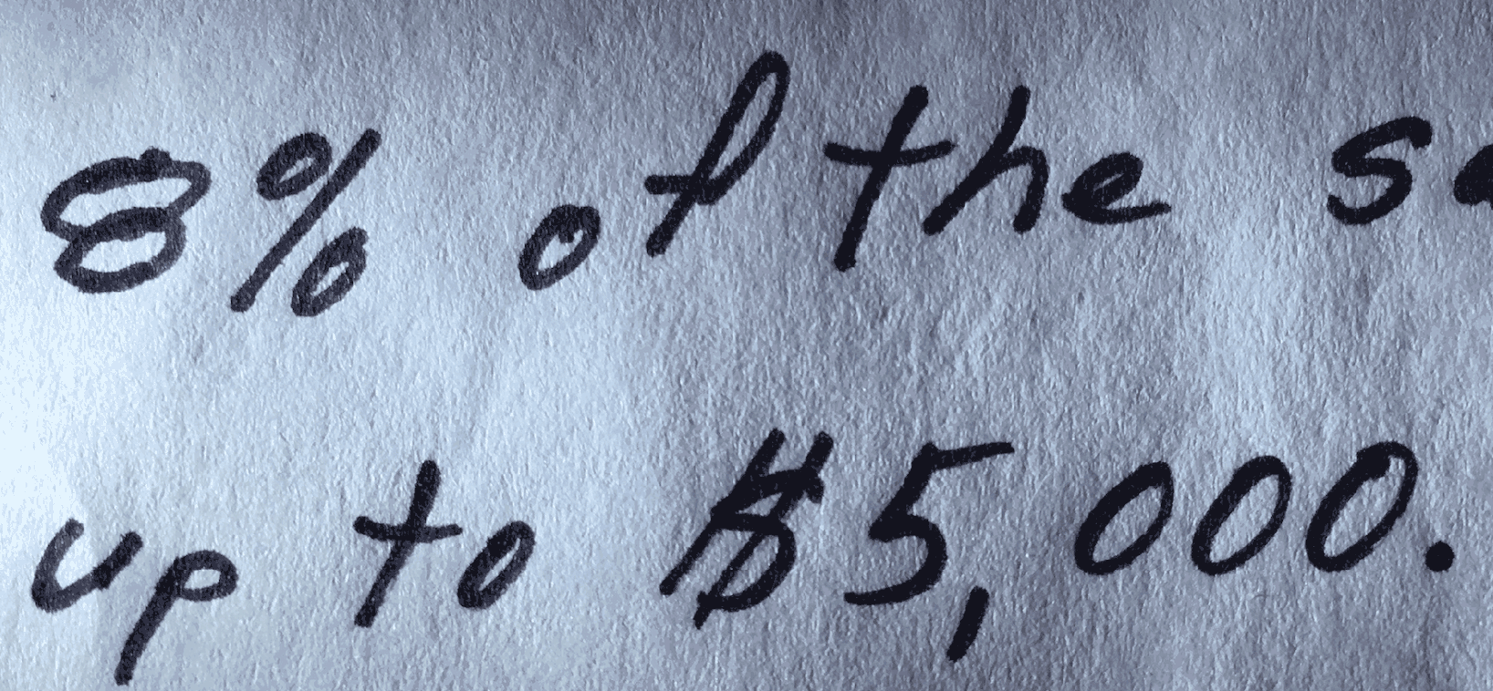 black text handwriting on white paper